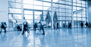blurred-people-walking-modern-hall